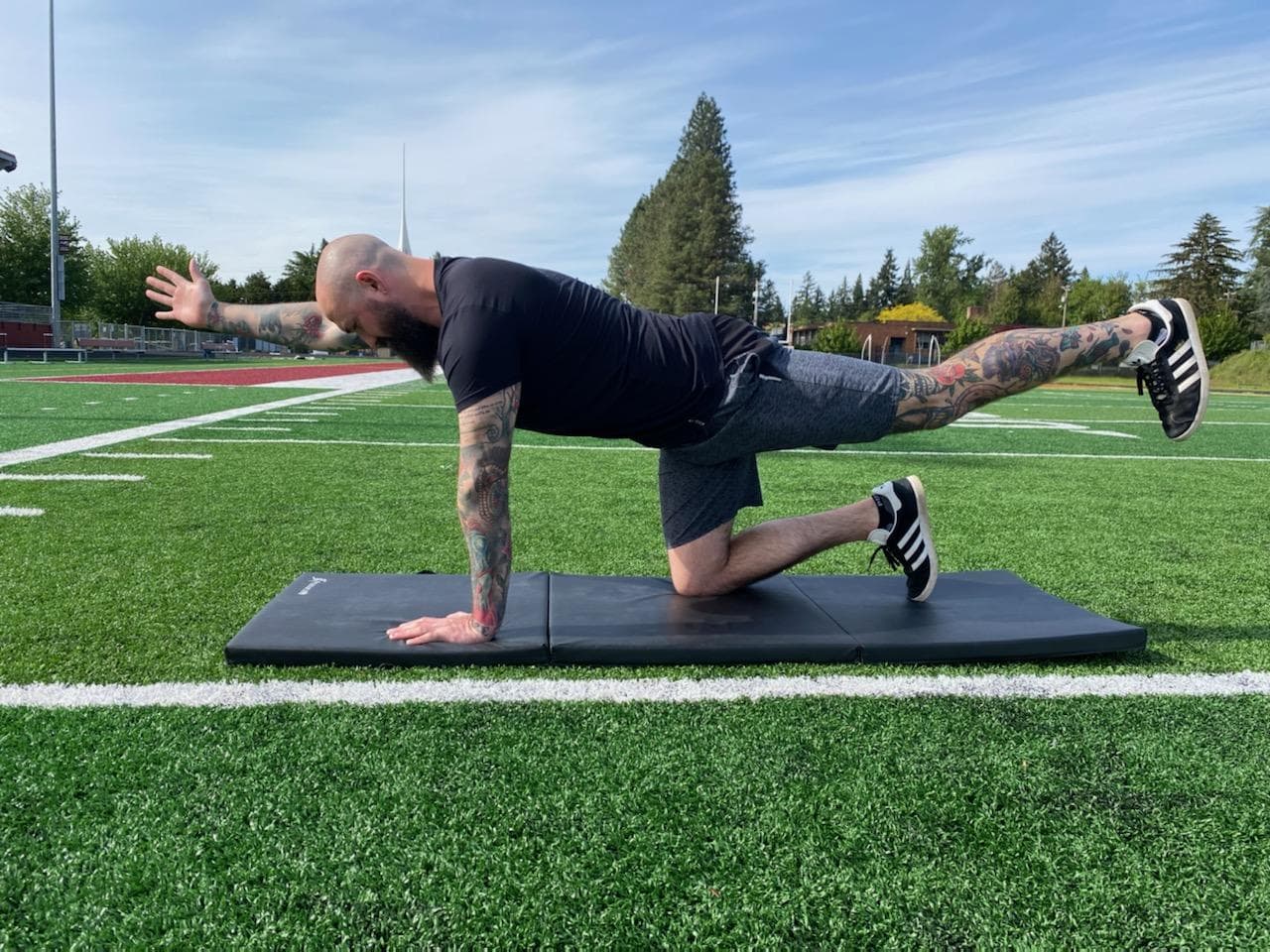 Vincent Parks personal trainer stretching in the park